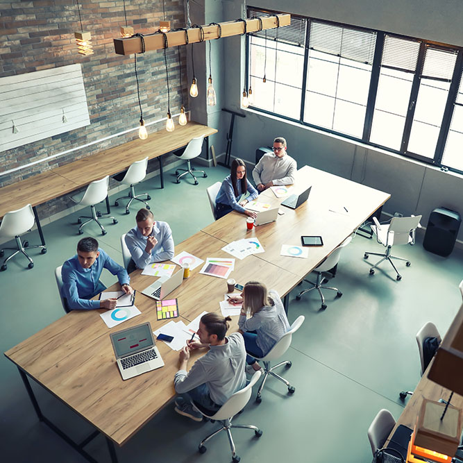 Young people having business meeting in modern office